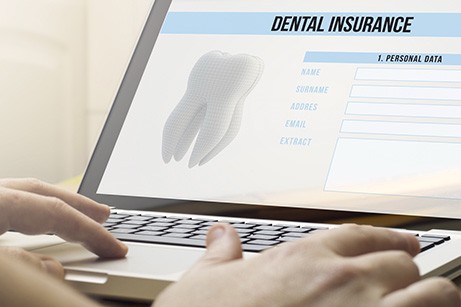 A patient checking their dental insurance online