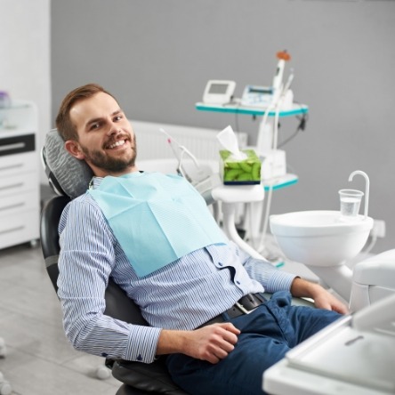 Bearded man leaning back in dental chair