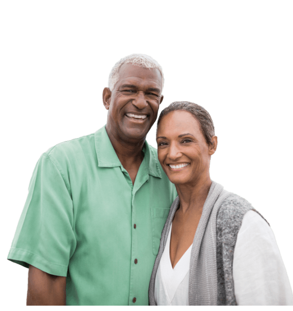 Man and woman with dental implants in Mesquite smiling