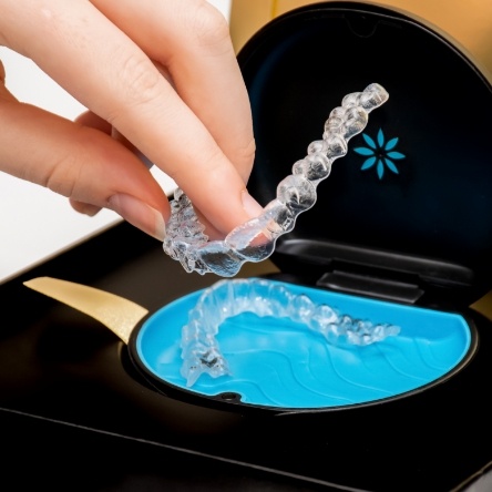 Taking Invisalign aligners out of their case