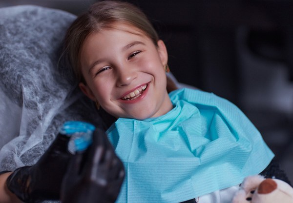 Young patient in Balch Springs smiling in the dentist chair