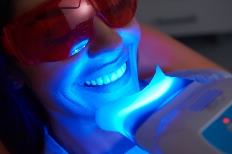 Woman smiling during in office teeth whitening