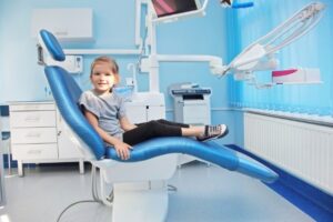 Young girl in dentist’s chair